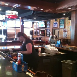 a woman working at the bar