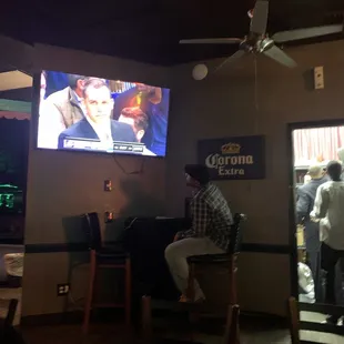 a man watching television
