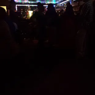 a crowd of people at a bar
