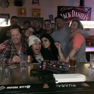 a group of people at a bar