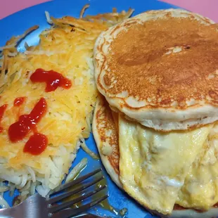 Dunkin Griddle (scrambled eggs, sausage, and cheese between 2 pancakes) breakfast special plus Hash Browns