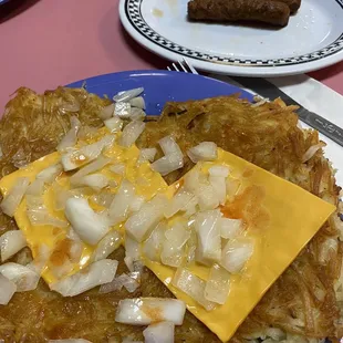 Hash browns with onion and American cheese, side of link sausage