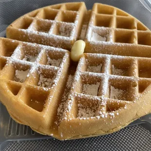 a waffle with powdered sugar