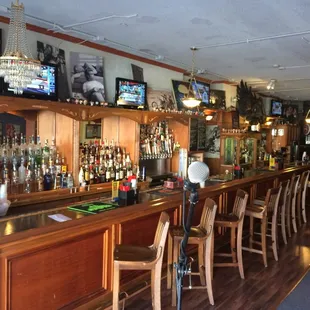 a bar with a row of bar stools