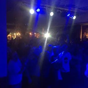 a group of people dancing at a party