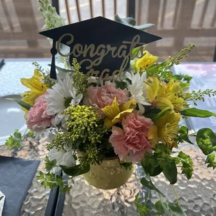 a graduation flower arrangement