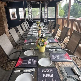 a long table set with place settings