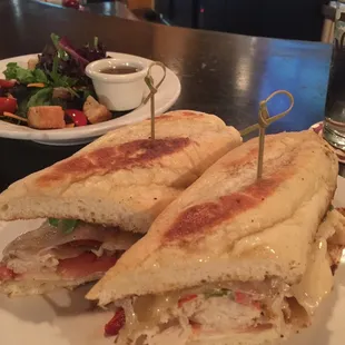 Burque Turkey Sandwich  Grilled sliced turkey breast topped with Swiss cheese and hatch green chile, on a toasted baguette. Yummy!