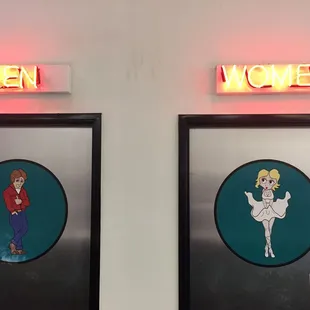 men and women on the wall