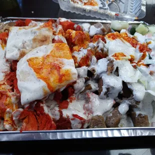 Chicken and Lamb Platter, extra protein, red and white sauce.