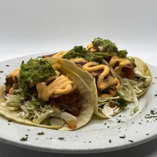 two tacos on a white plate