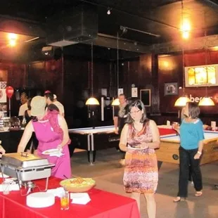 a group of people serving food