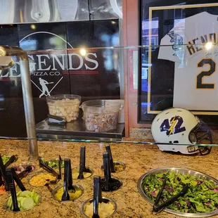 a salad bar with a helmet on it