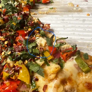 a slice of pizza with several toppings