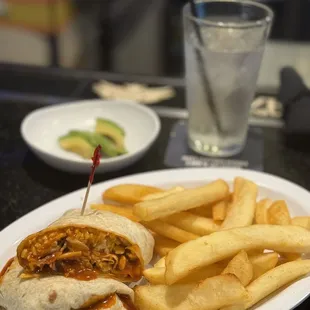 Chicken Wrap with Grilled Chicken Breast and Fries. Guiltless avacado slices .