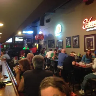 customers sitting at the bar