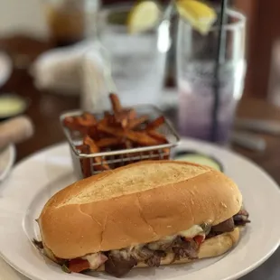 Philly cheesesteak sandwich with sweet potato fries.  Not enough cheese and fries were way overcooked.