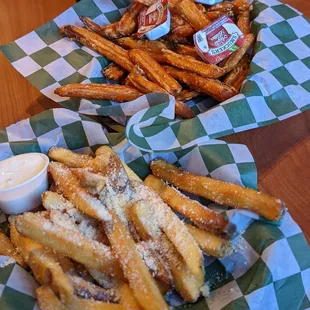 two baskets of fries and a dip