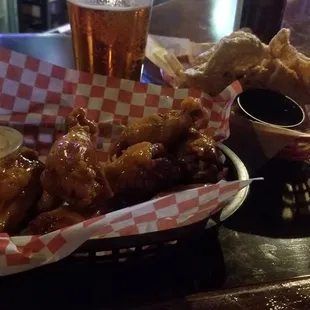 Wings, pork rinds, and beer