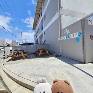 Outdoor seating on the corner of Mokauea Street and Hau Street