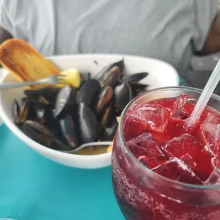 ws a bowl of mussels and a glass of wine