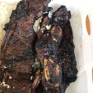 1 out of the 3 strips of my short-ribs were burnt and inedible. $12! The rice was undercooked and the macaroni salad had no flavor.