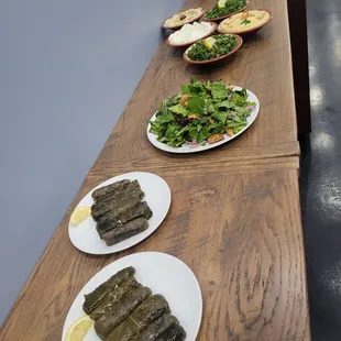 a long table with plates of food on it