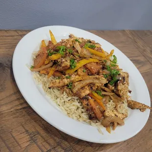 a plate of chicken and vegetables