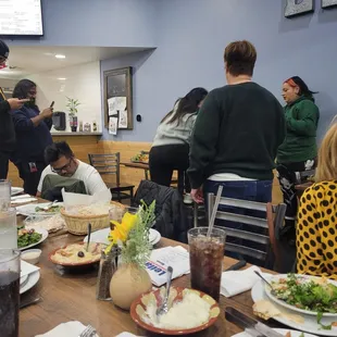 a group of people sitting at a table