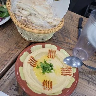 a plate of hummus and pita