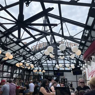 people sitting at tables with laptops