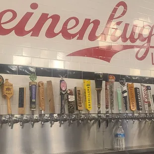 a row of beer taps