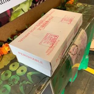 Three leis in box to take on airplane. Box is about 8&quot;x4&quot;x14&quot;
