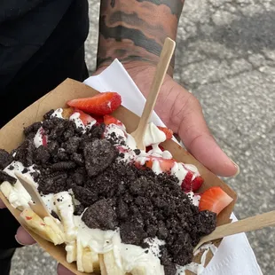 Banana, strawberries, Oreo and pancakes with white chocolate