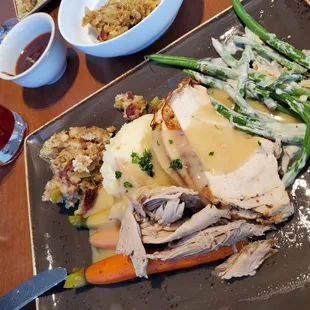 The turkey dinner with all the fixings. Purple Bulleit cocktail to the left. Everything was great!