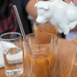 Iced coffee with cute milk pourer