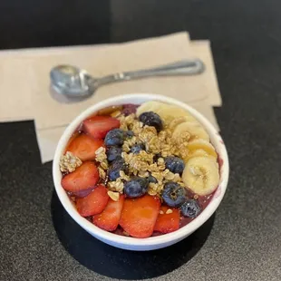 a bowl of fruit and granola