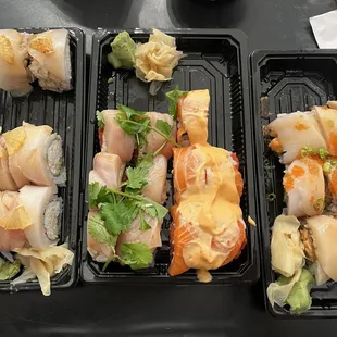 To-go order (left to right): Yellowtail &amp; Lemon Roll, Baja Fresh Roll, Sunshine Roll, Down Town Roll