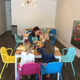 Dora helping kids make tissue paper cards @ the studio!