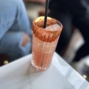 a close up of a drink with a straw