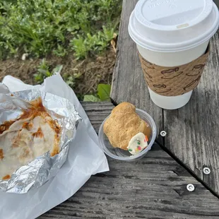 a cup of coffee and a sandwich