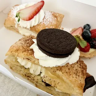 Strawberry and Oreo Milhojas and fruit tart in the back