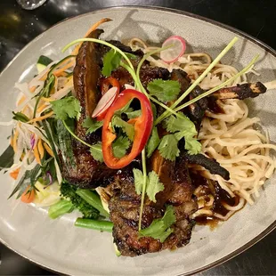 Lamb chops over garlic noodles