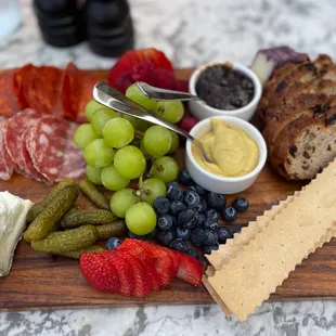 Stunning charcuterie board and also a must order! You honestly can't go wrong with anything on their menu