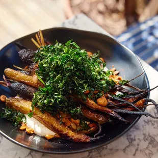 BURNT RAINBOW CARROTS 
herbed labneh, pumpkin seed