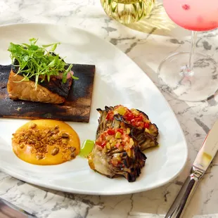 GRILLED CEDAR PLANK MISO SALMON maitake mushroom, dukkah spice, chimichurri, roasted chili aioli