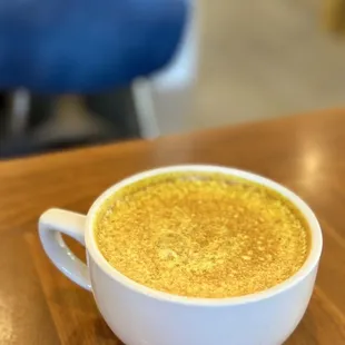 a cup of coffee on a table