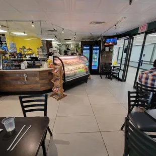 View from our table. Dessert display case straight ahead. Doorway to the building interior is on the right.