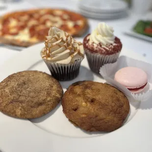 Snickerdoodle cookie, salted caramel cookie, red raspberry macaron, peanut butter chocolate cupcake, red velvet cupcake