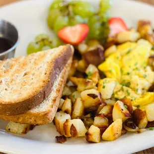 "The Usual" Eggs. Came with choice of white or wheat toast, house jam with fresh blueberries. Potato hash $3 add on.